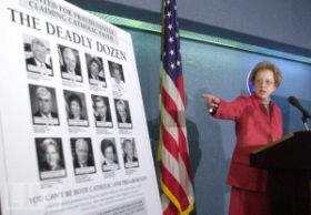 ALL president Julie Brown points to her organization’s ‘Deadly Dozen’ poster.