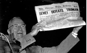 President Harry Truman triumphantly displays a newspaper headline declaring victory for his opponent, Thomas Dewey. Dewey lost the election.