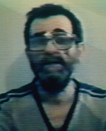 Blurry photo, taken from a television broadcast, of US hostage Edward Tracy.