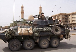 A Marine armored personnel carrier pulls out of Fallujah.