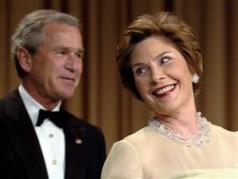 President and Mrs. Bush enjoy a laugh at the Correspondents’ Dinner.