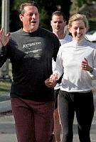 In an attempt to appear nonchalant for the press, Al Gore goes jogging with his daughter Karenna and with members of the press filming the proceedings.