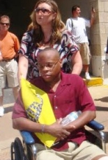 Kenneth Gladney being wheeled around a protest in Mehlman, Missouri.