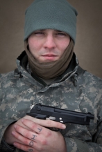 Private Lee Pray, a member of the Oath Keepers. His finger tattoo spells out ‘THOR.’
