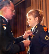Jessica Lynch receives one of three medals awarded to her for her service in Iraq.