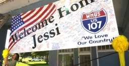 A banner welcoming Jessica Lynch home.