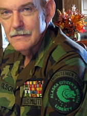 Norm Olson. Olson is wearing an ‘Alaska Citizens’ Militia’ shoulder patch as part of his pseudo-military garb.