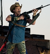 Rock musician Ted Nugent, brandishing an assault rifle on stage in this undated photo. It is not clear whether the rifle is real.