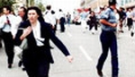 Water Resources Board members and others flee into the streets after the bombing.