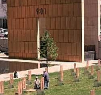 Workers put the finishing touches on the Oklahoma City National Memorial. The time of the bombing, ‘9:01,’ is inscribed on the side of the memorial.
