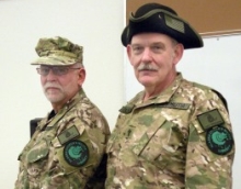 A 2009 photo of Ray Southwell and Norm Olsen. Both are wearing Alaska militia emblems.