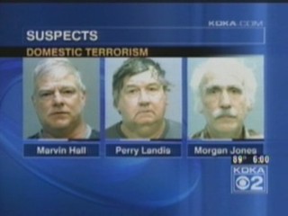 A screenshot of a local Pittsburgh news broadcast showing three of four suspects arrested on charges of domestic terrorism.