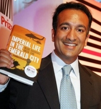 Author Rajiv Chandrasekaran, holding a copy of his 2006 book, ‘Imperial Life in the Emerald City.’