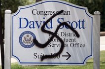 A swastika painted by an unknown party on the office sign of a Democratic supporter of health care reform. 
