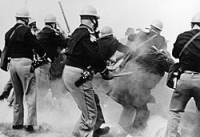 Alabama police attack civil rights marchers on the Edmund Pettus Bridge outside of Selma, Alabama.
