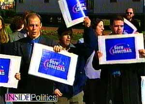 Bush supporters display ‘Sore Loserman’ signs.