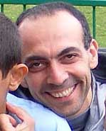 Bisher al-Rawi holding a child after release.