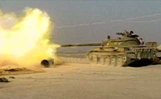 A Northern Alliance tank fires on Qala-i-Janghi fortress.