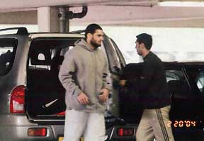 A surveillance photo of Momin Khawaja (in grey sweater) and unidentified man on February 20, 2004.