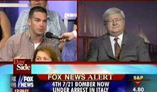John Loftus (right) is asked a question from an audience member while on Fox News on July 29, 2005. 