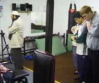 Ronson’s footage of Omar Bakri Mohammed, left, leading followers in prayer inside the Scout hut.