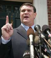 Hatfill holding a press conference on August 11, 2002.
