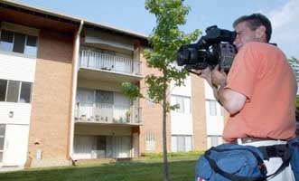 A television film crew at Steven Hatfill’s apartment on August 1, 2002.